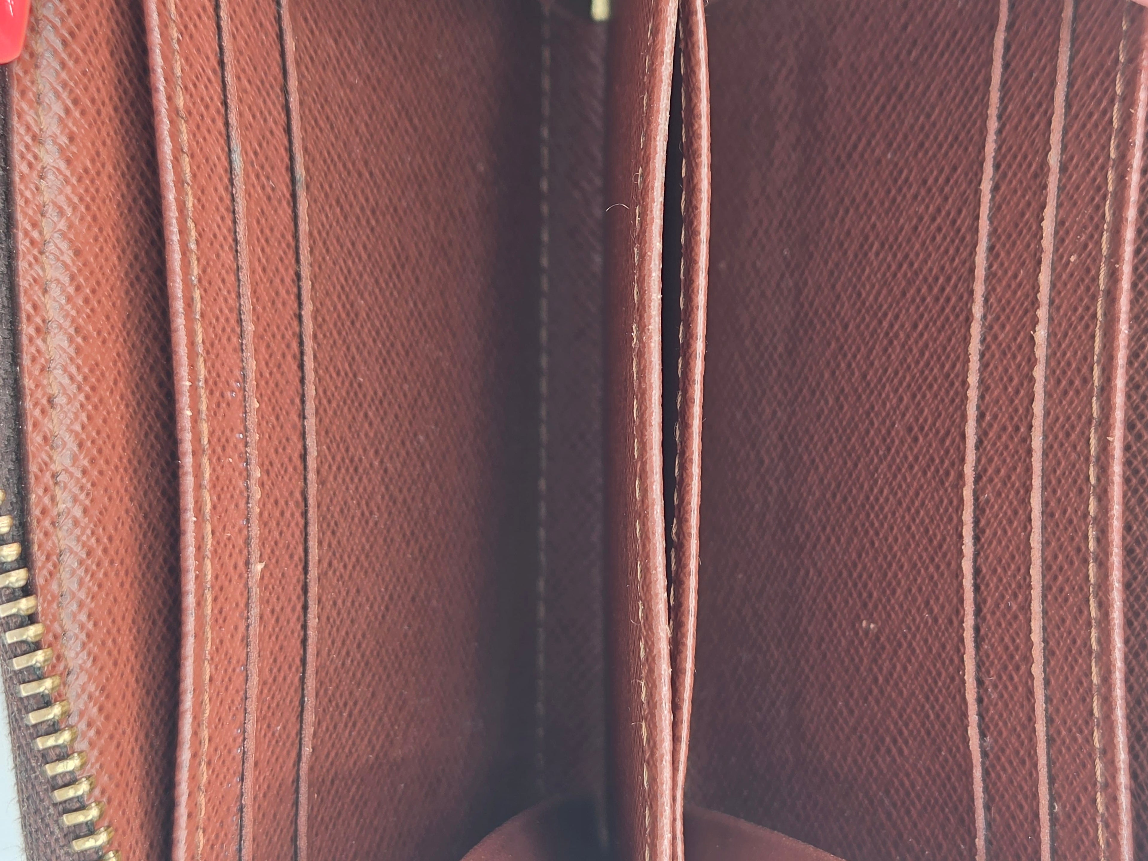 Close-up of a brown textured fabric with a zipper