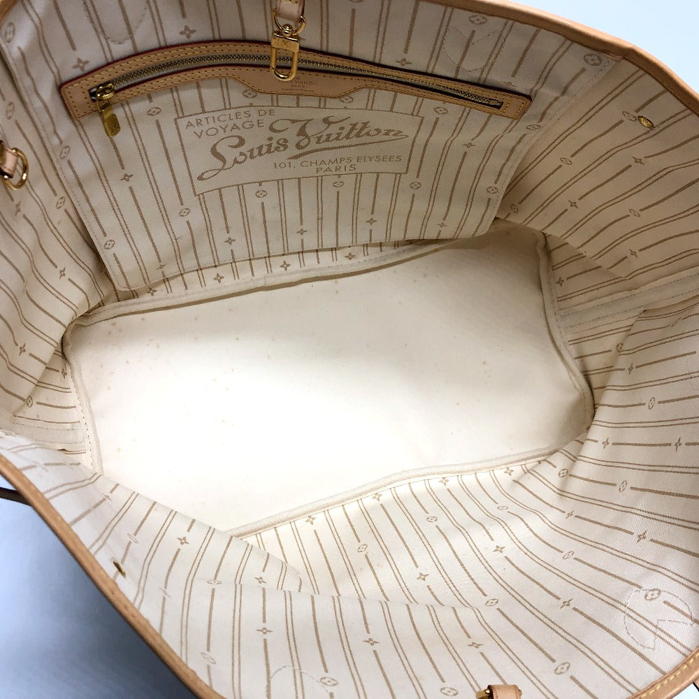 Close-up of the interior of a Louis Vuitton handbag with visible branding.
