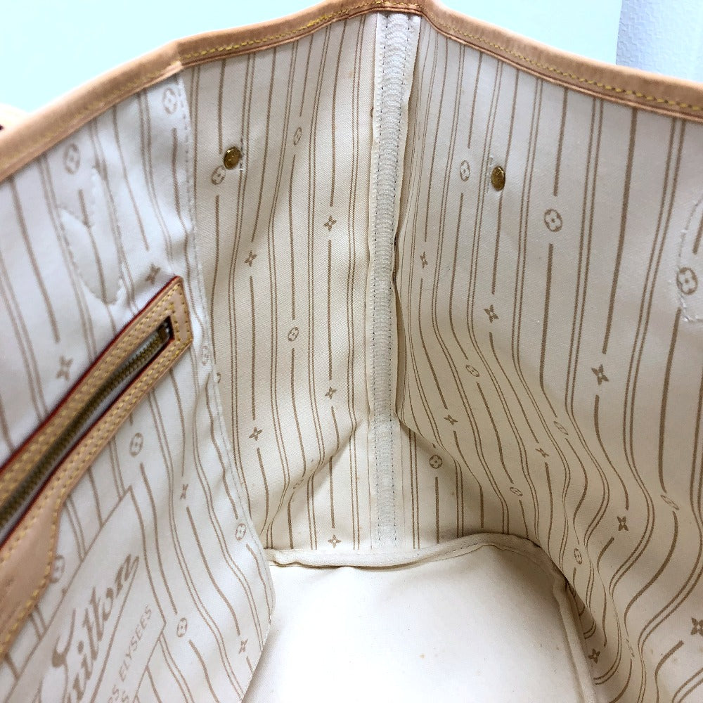 Close-up of a patterned interior of a handbag with visible branding.