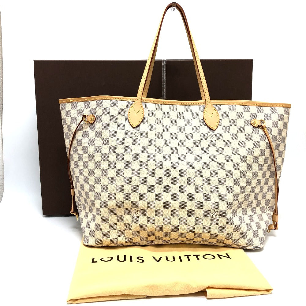 Louis Vuitton handbag with checkered pattern on a white background