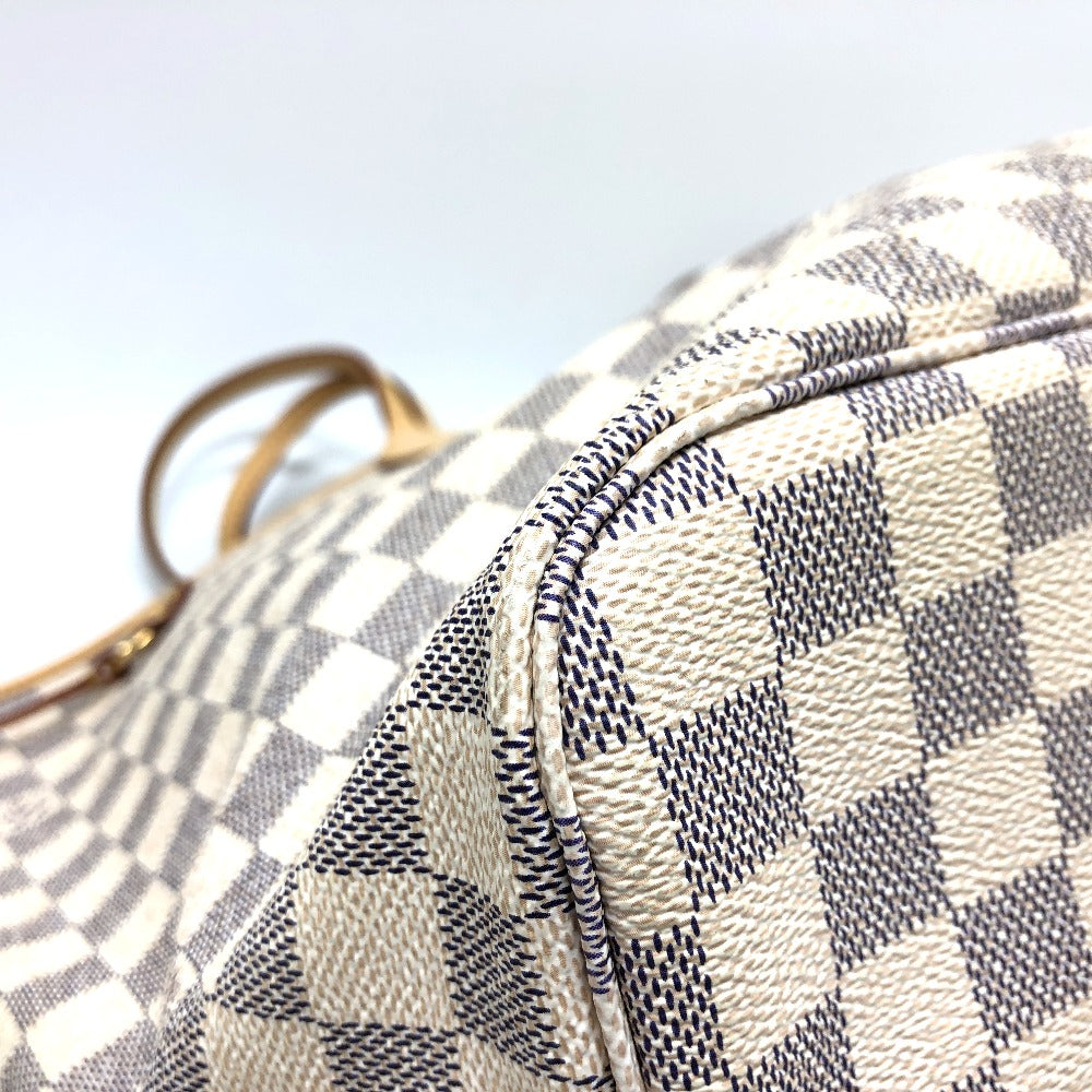 Close-up of a checkered handbag with a blurred background