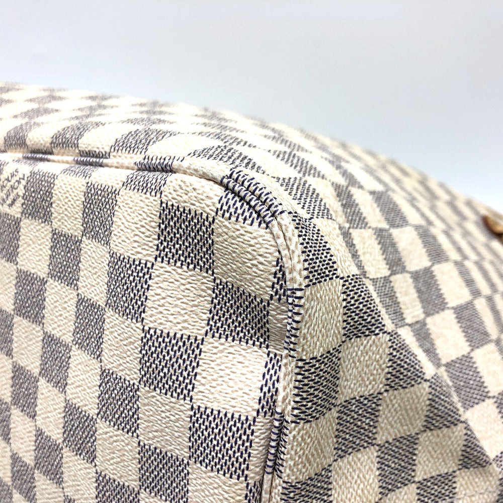 Close-up of a checkered pattern on a surface with a light gray background