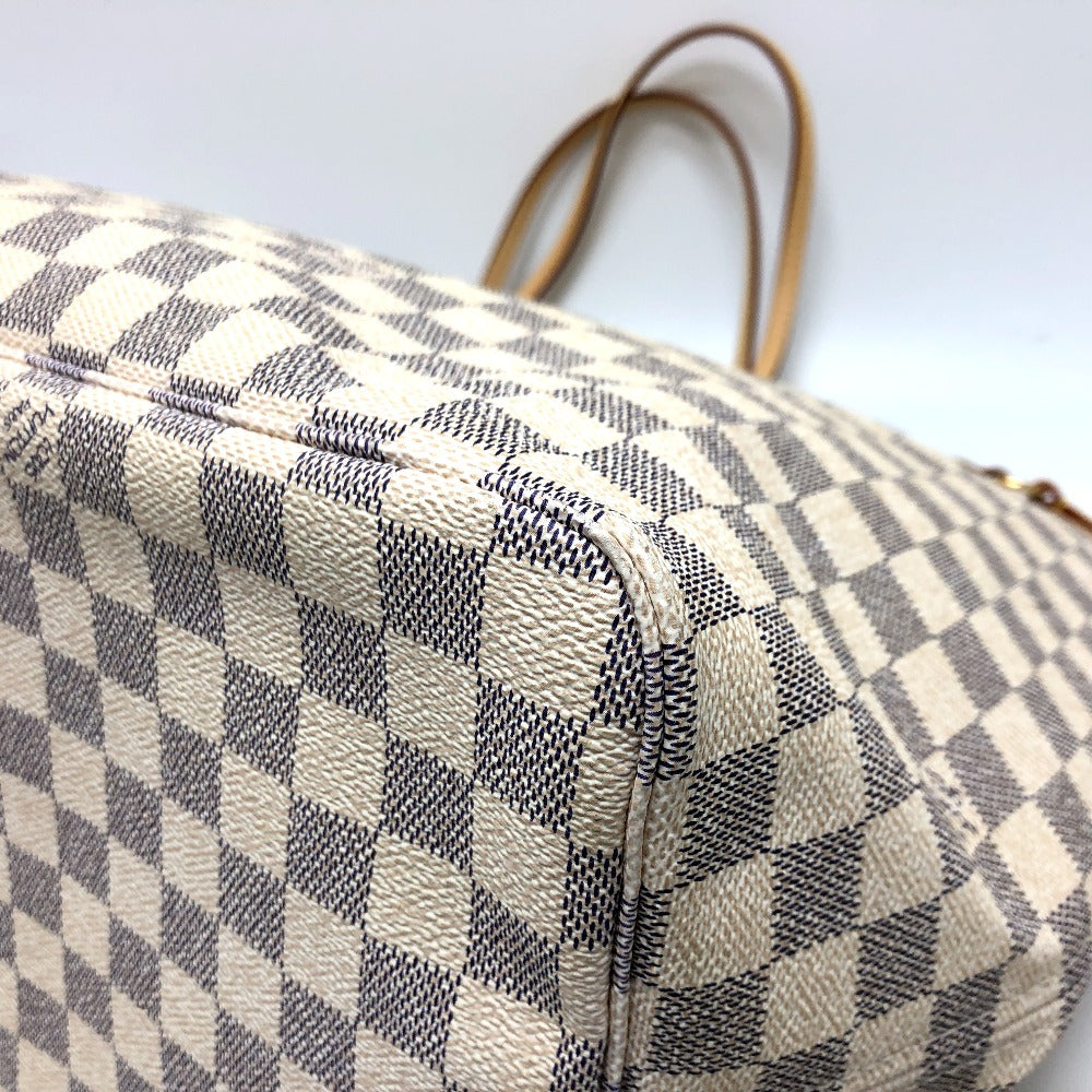 Checkered handbag with a white and gray pattern on a light background