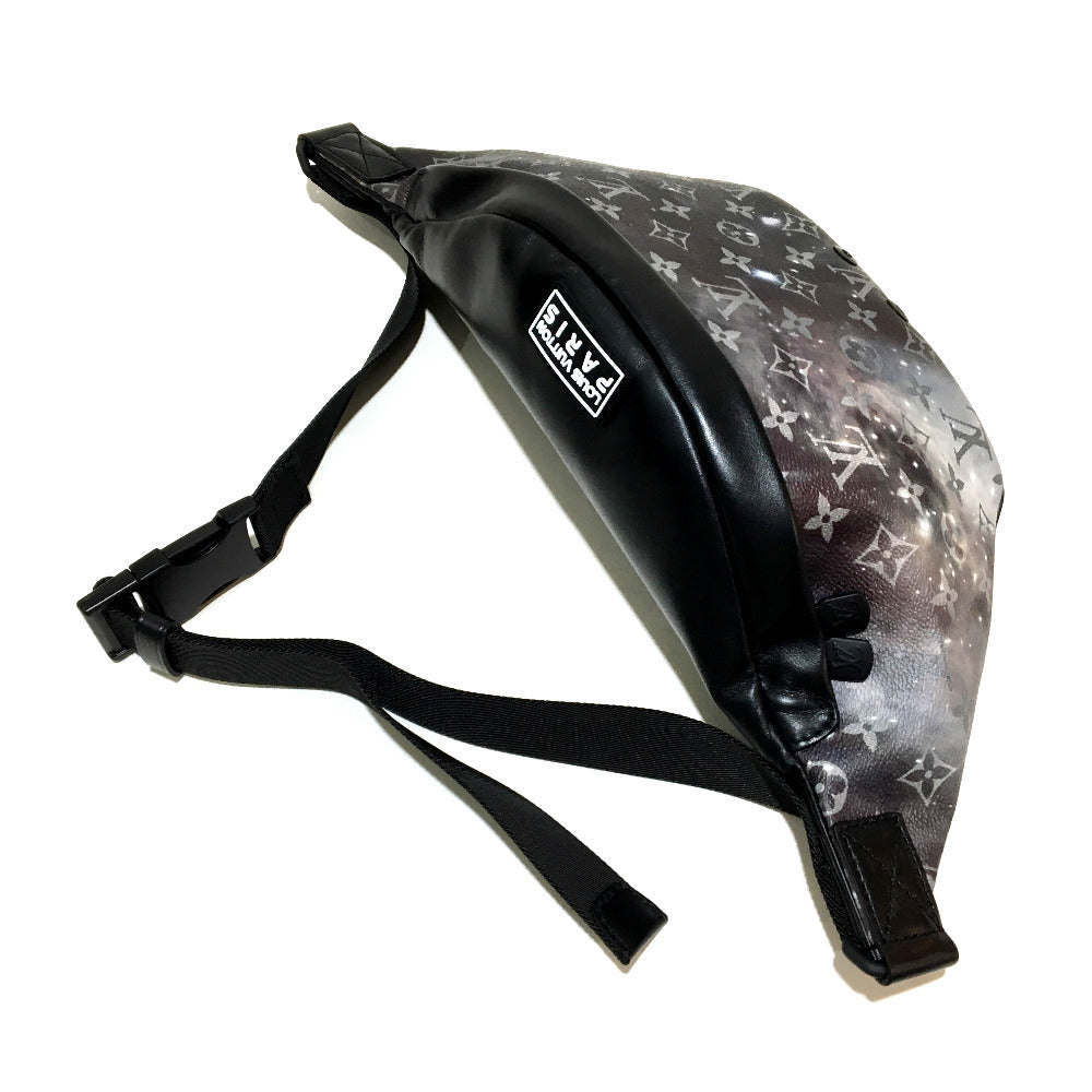 Black and gray patterned bag with a strap on a white background