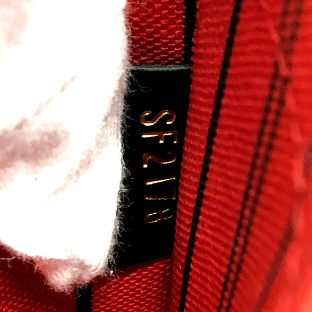 Close-up of a red fabric with a black label displaying 'SF218'.