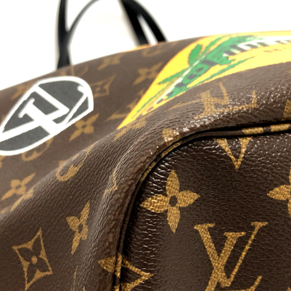 Close-up of a brown leather bag with a prominent logo and colorful design.