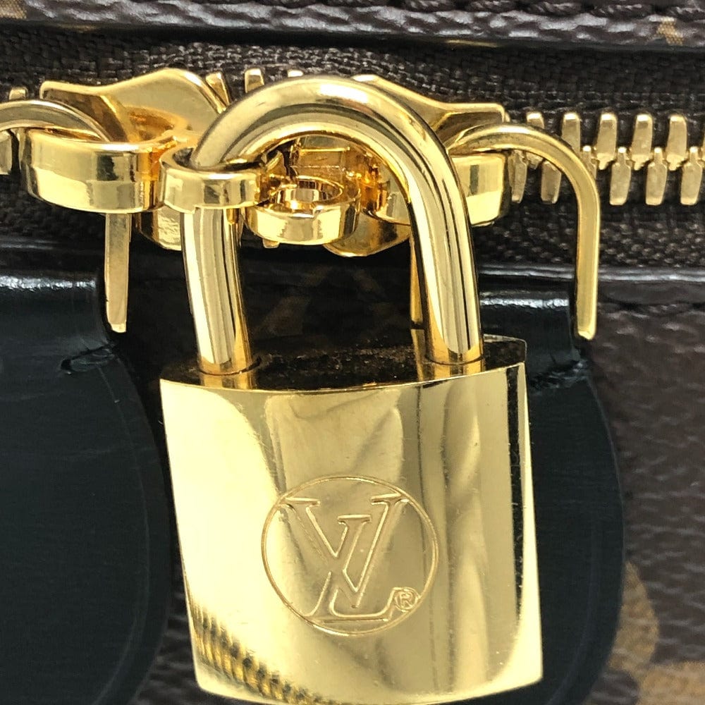 Gold padlock with Louis Vuitton logo on a black background