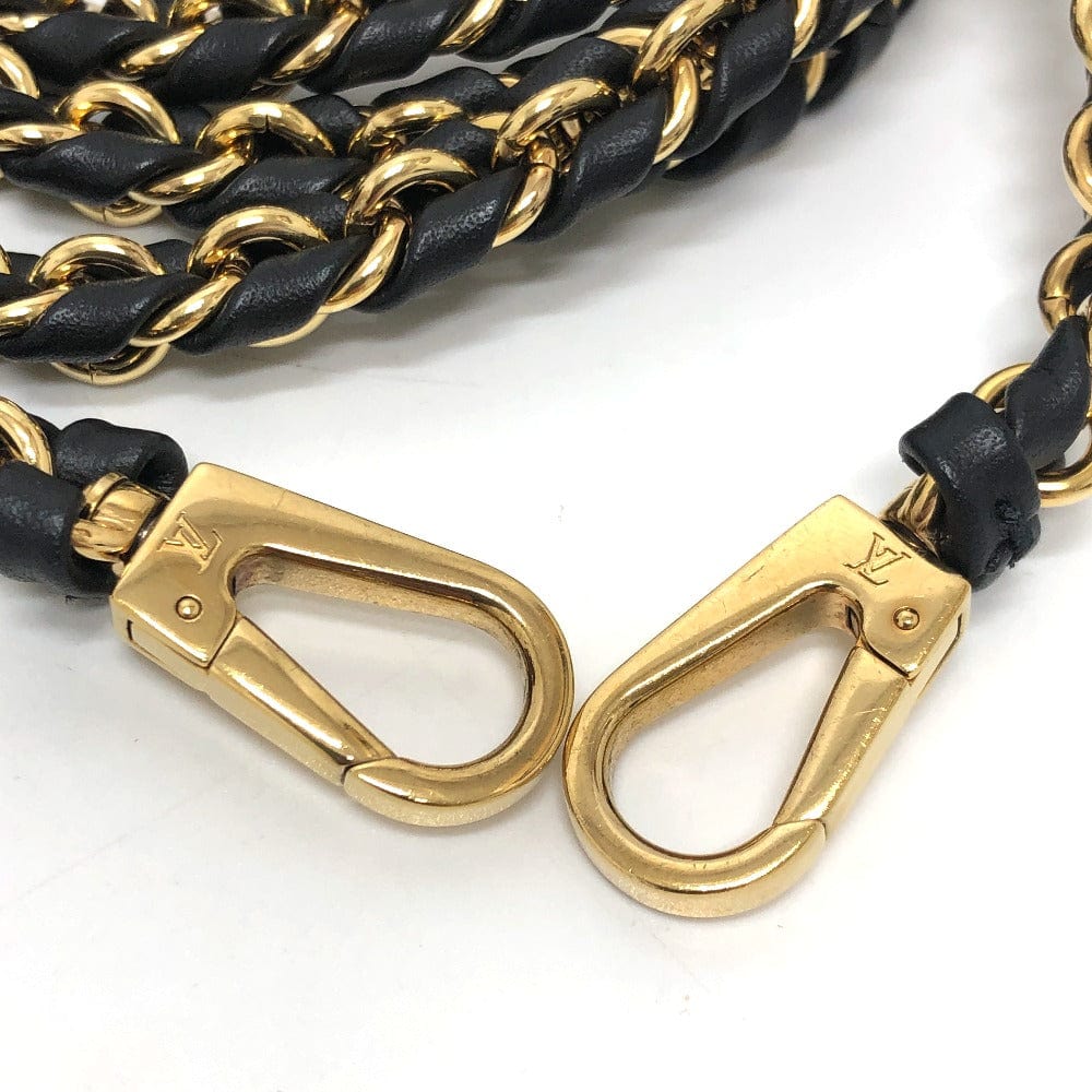 Gold carabiners with black braided leather straps on a white background