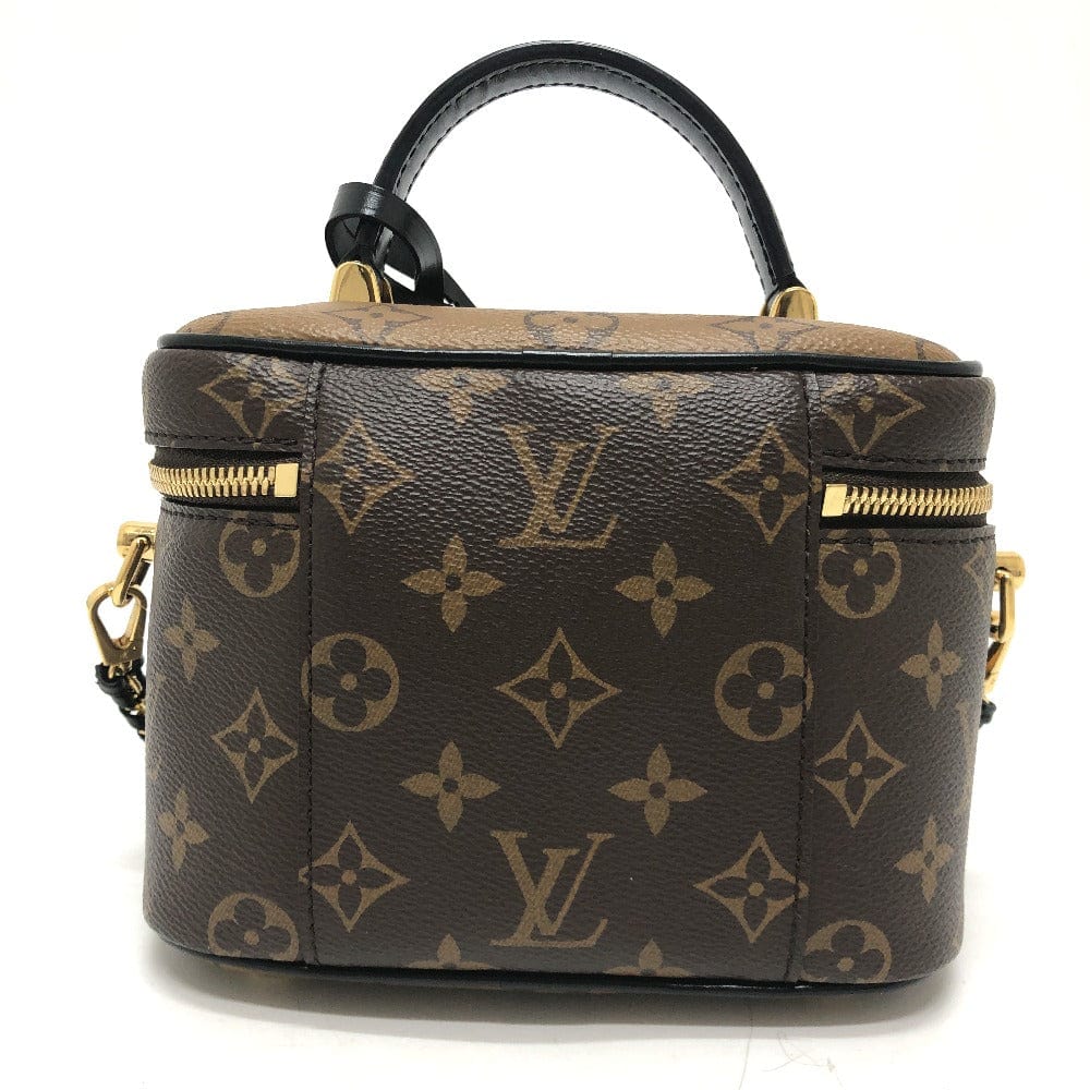 Brown handbag with gold accents on a white background