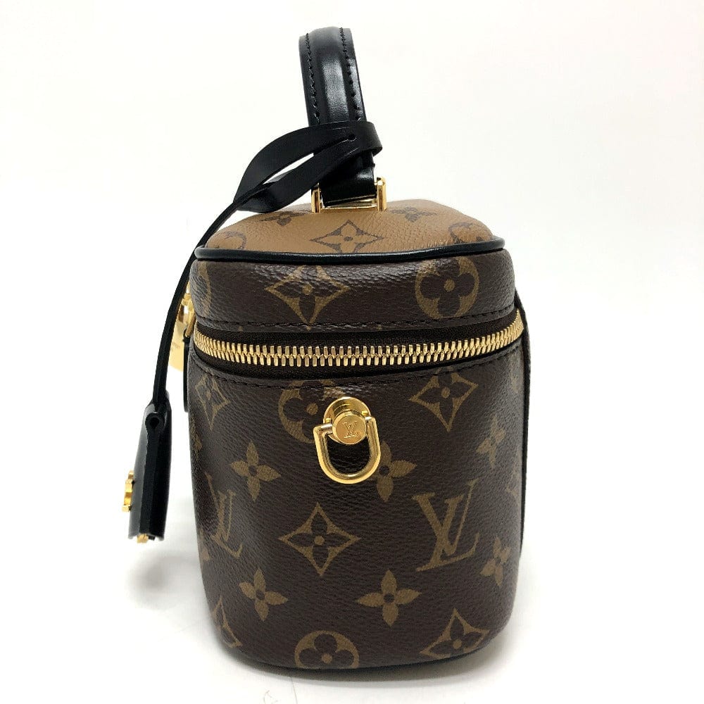 Louis Vuitton monogram handbag with gold zipper on a white background