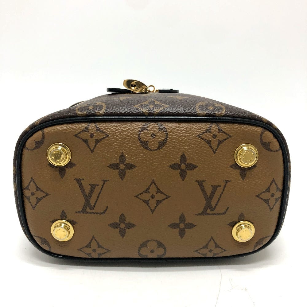 Louis Vuitton handbag with monogram pattern and gold accents on a white background
