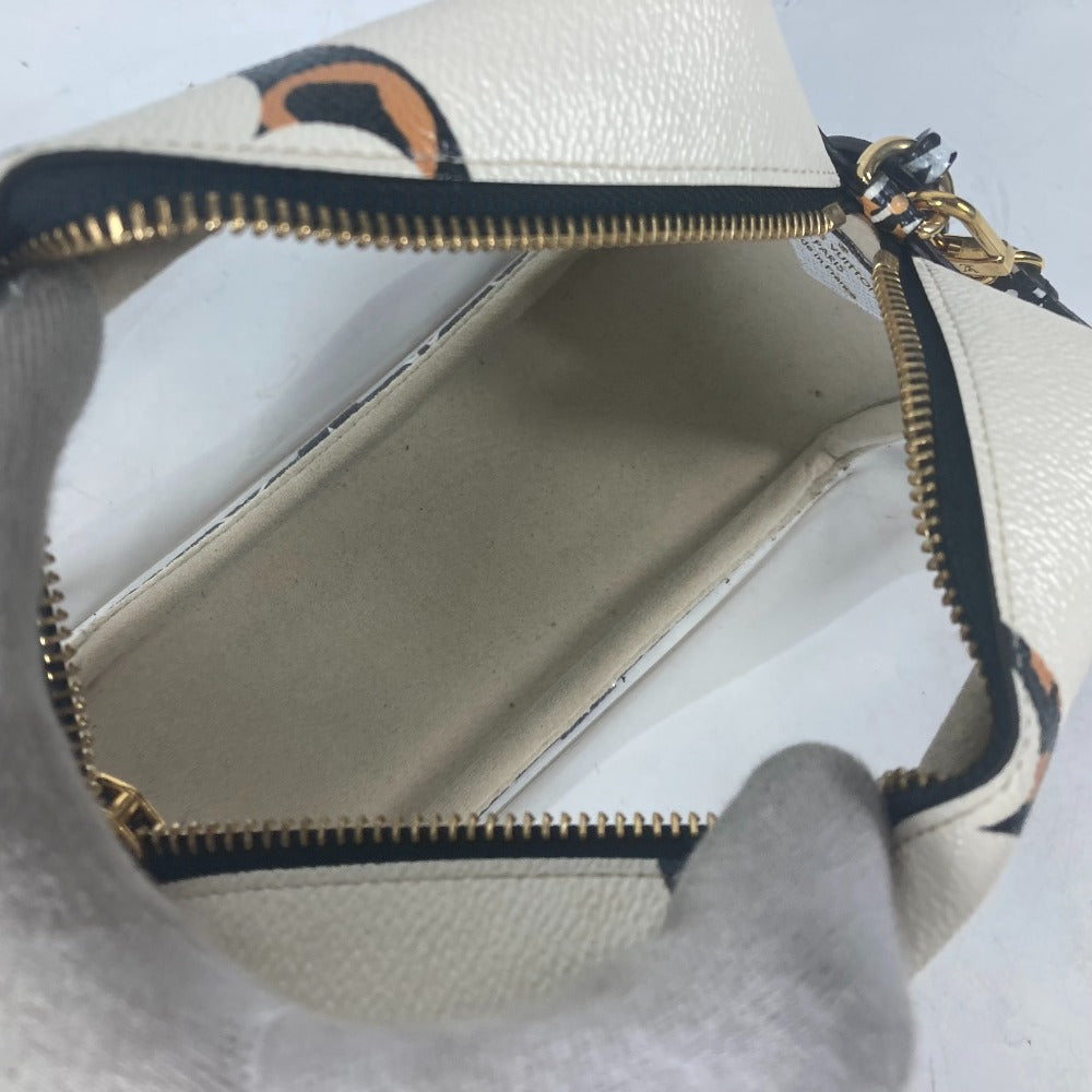 Close-up of a white handbag with gold zipper and black trim on a white background