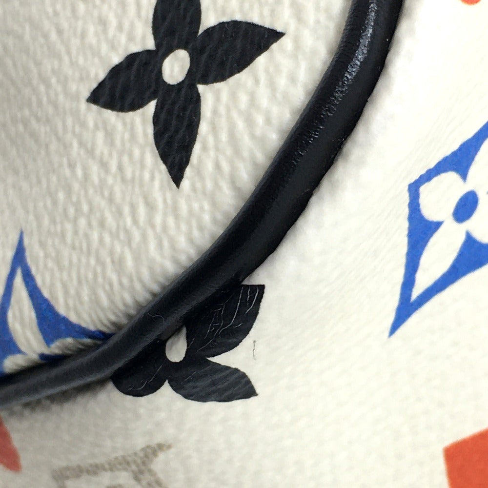 Close-up of a textured surface with black floral design and colorful geometric patterns.