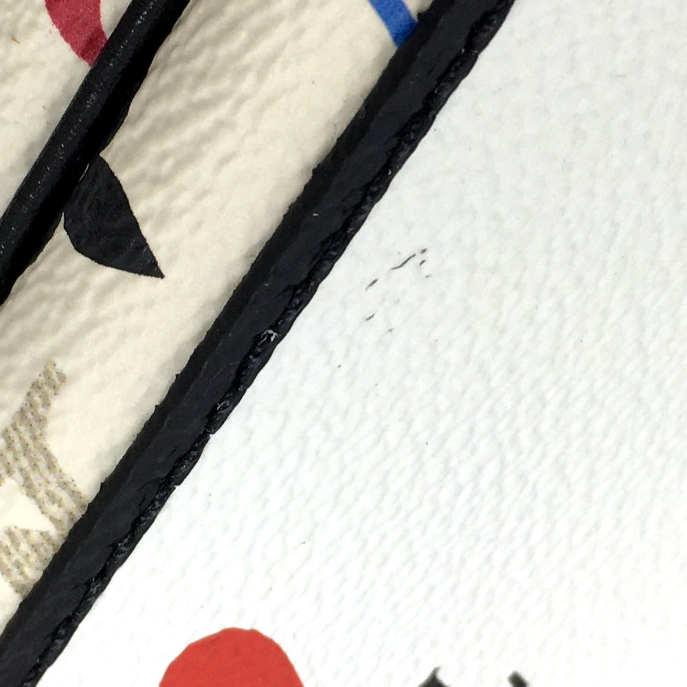 Close-up of a textured surface with black, red, and white elements