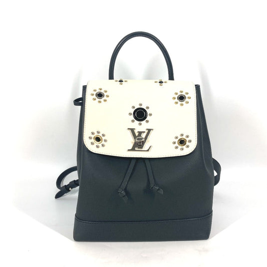 Black backpack with a white flap featuring a logo on a white background