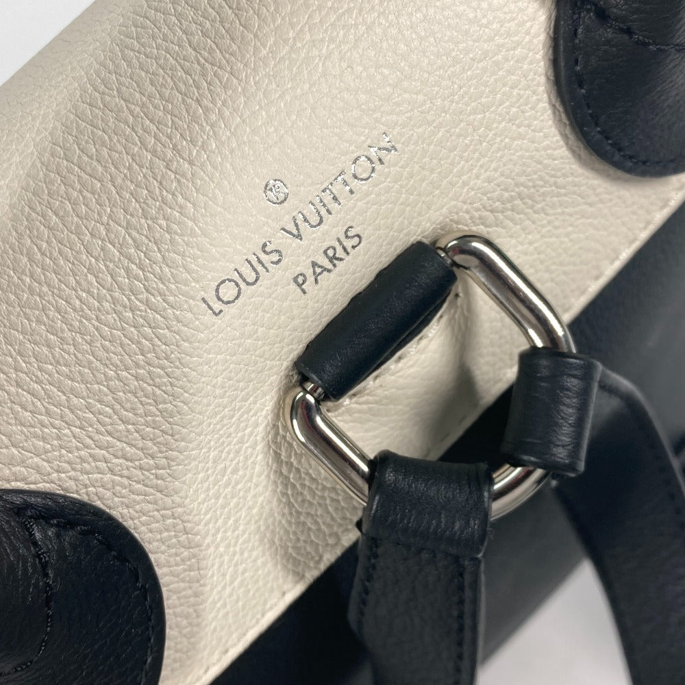 Close-up of a Louis Vuitton handbag with visible branding.