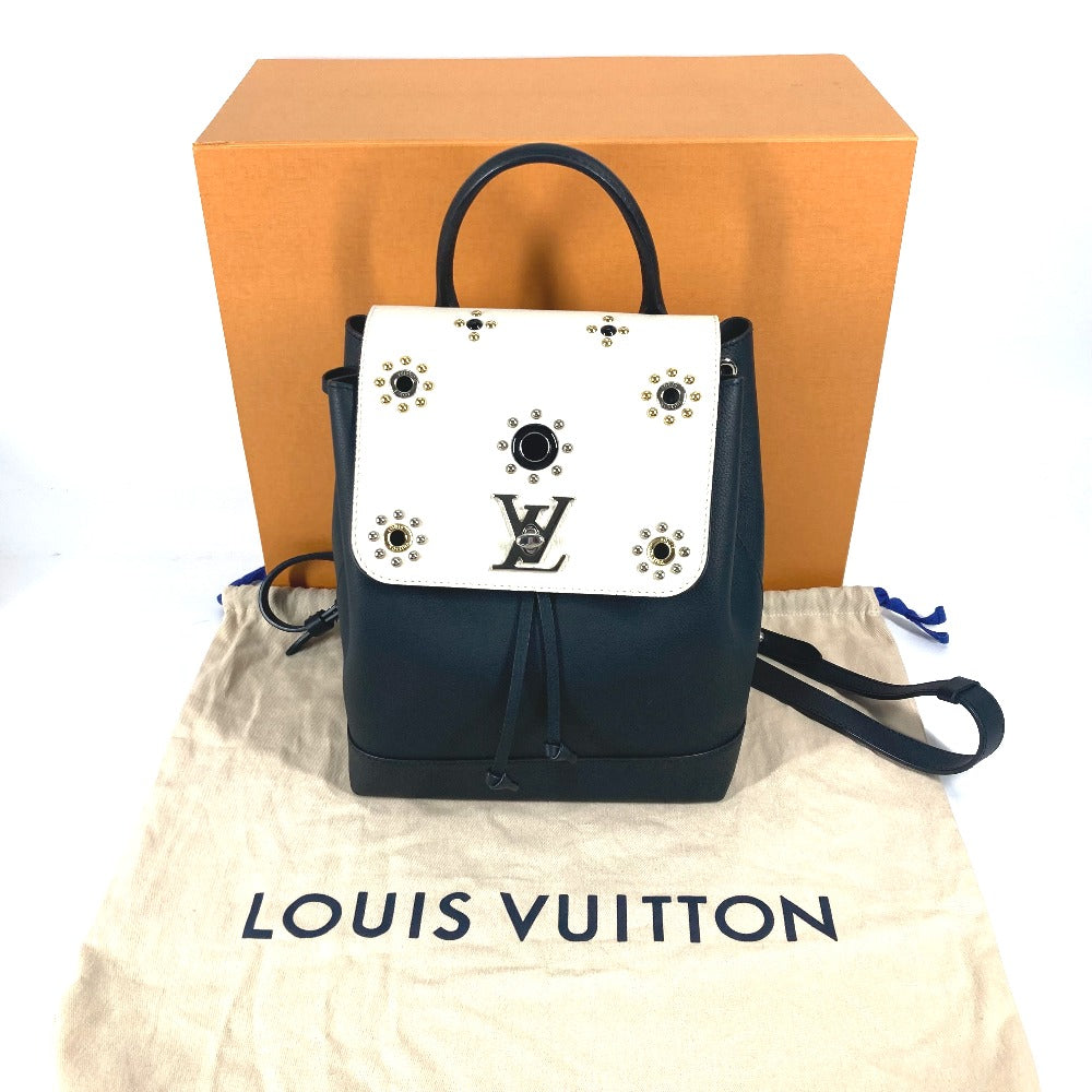 Black and white Louis Vuitton bag with star embellishments on a white background