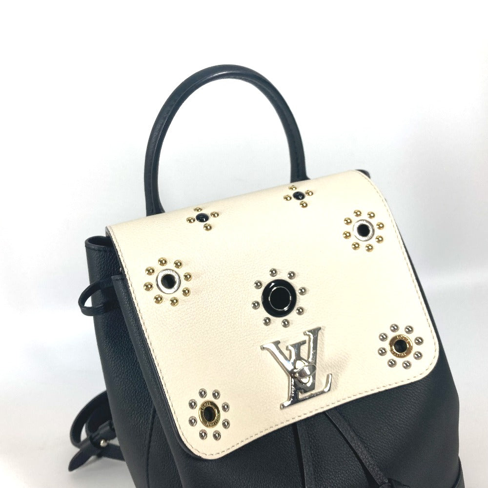 Designer handbag with embellishments on a white background