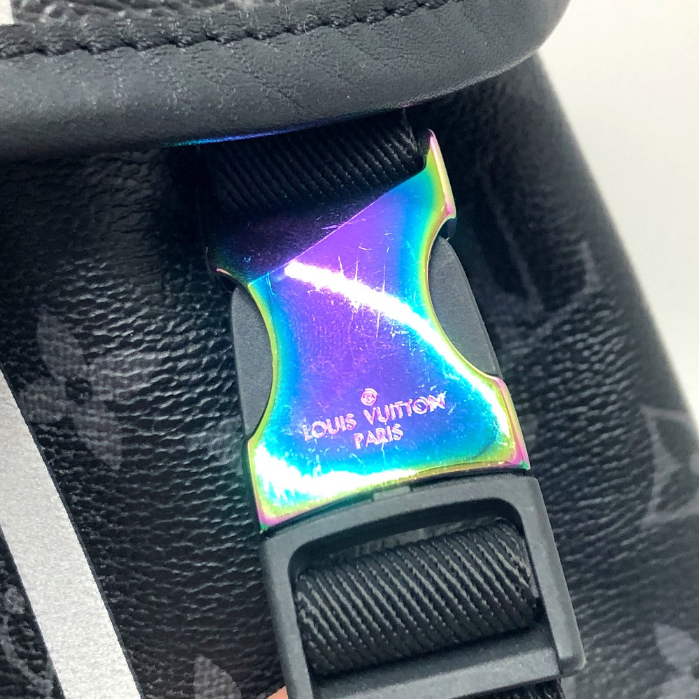 Holographic Louis Vuitton buckle on a black leather bag