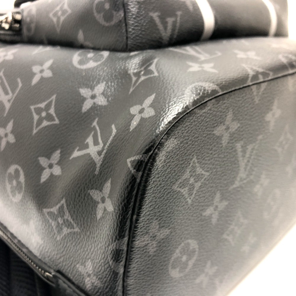 Close-up of a Louis Vuitton monogram handbag with visible brand logo.