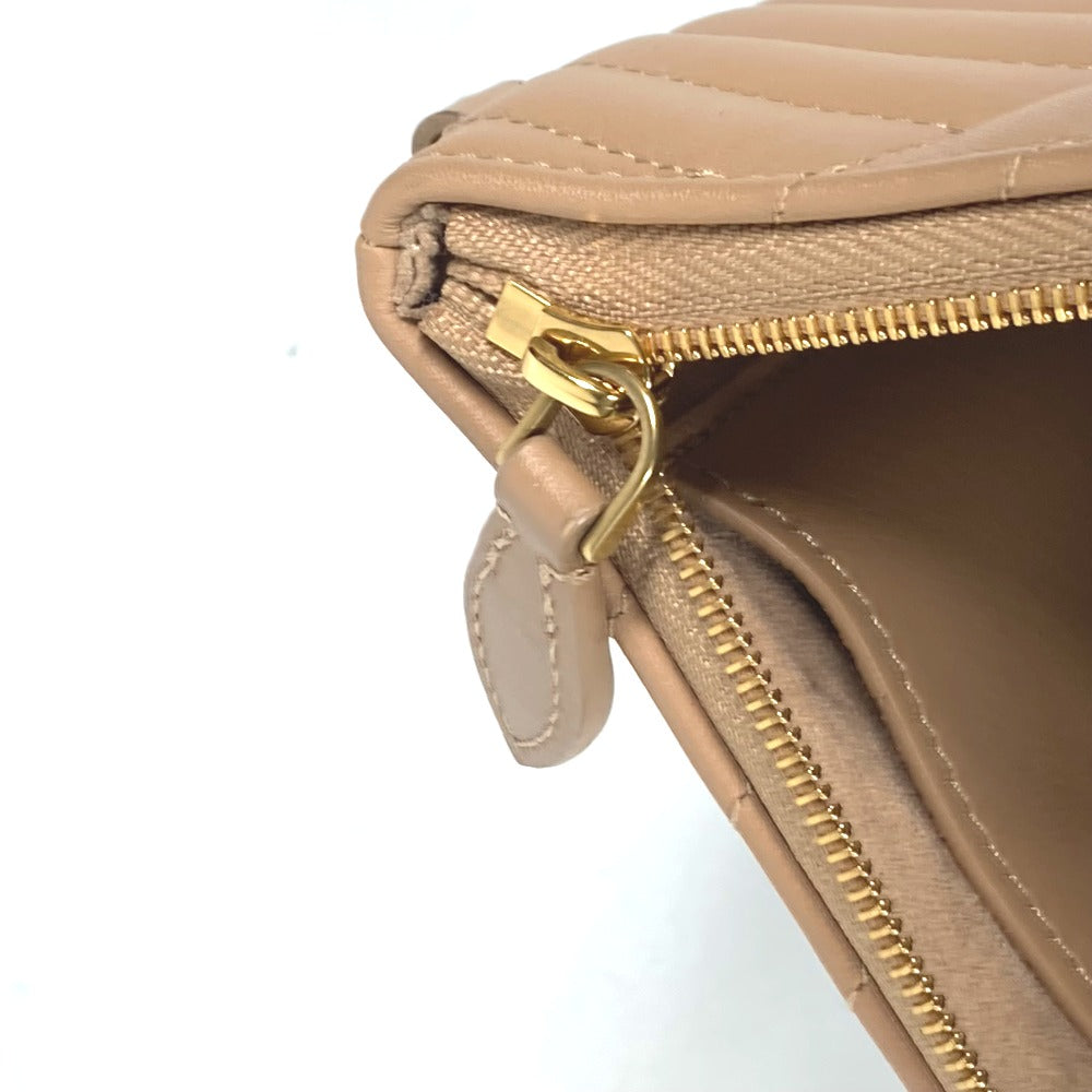 Beige wallet with gold zipper on a white background