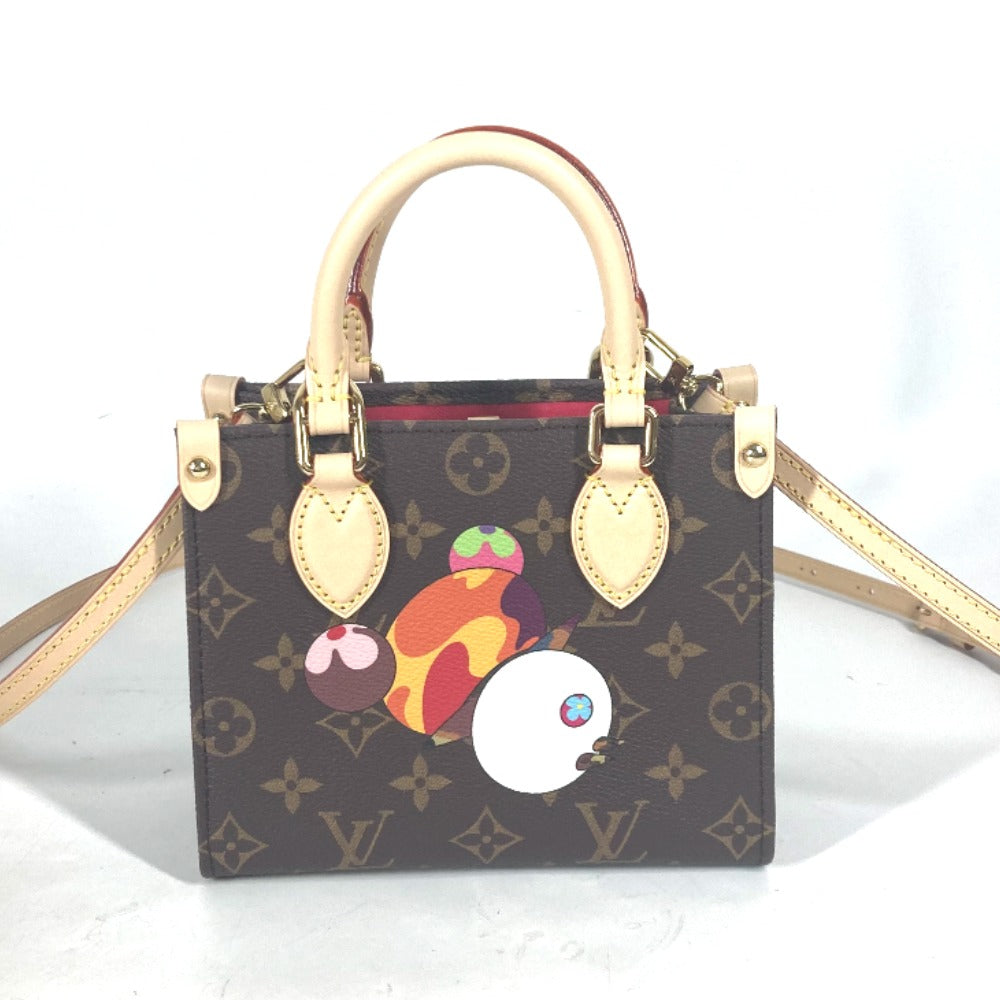Designer handbag with cartoon character design on a white background