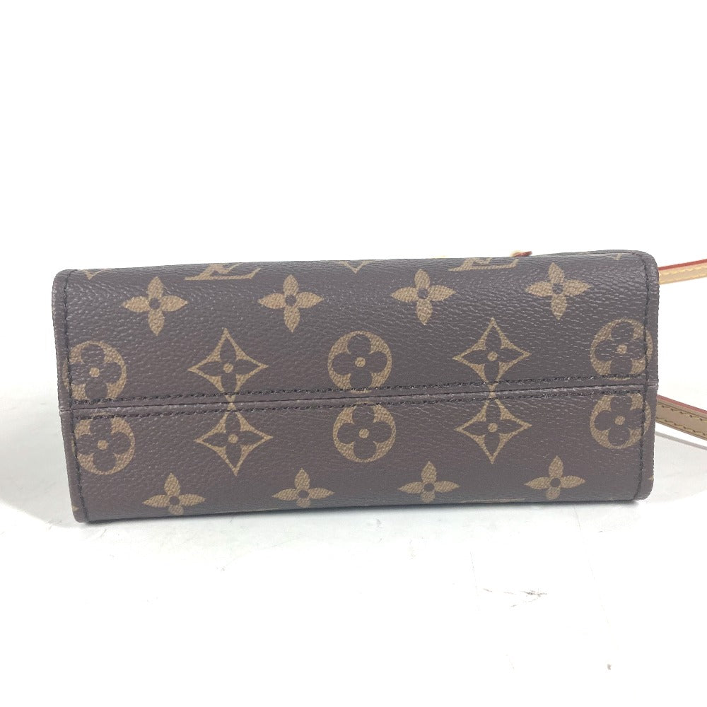 Brown wallet with gold monogram pattern on a white background