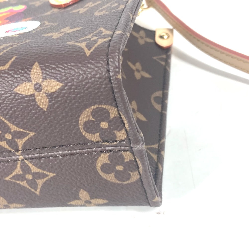 Close-up of a handbag with a monogram pattern on a white background