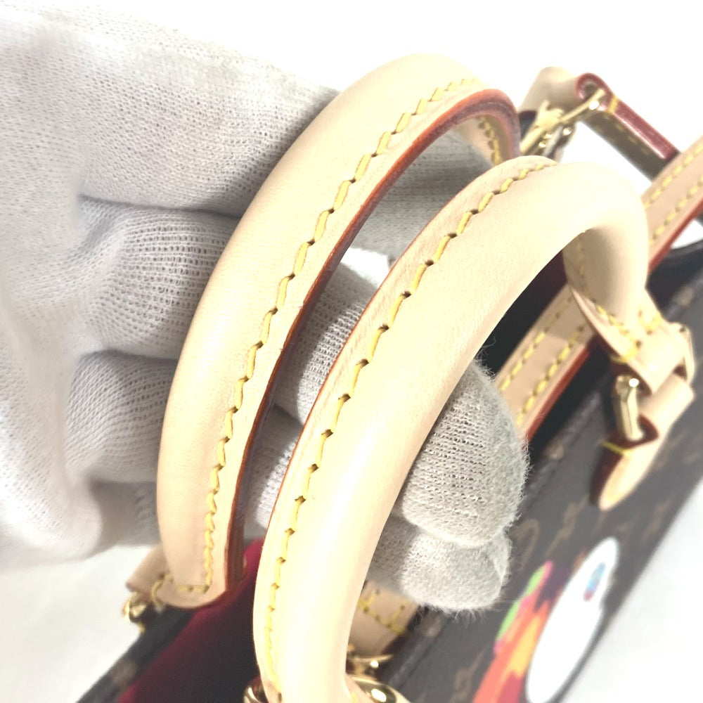 Close-up of a beige leather strap with gold stitching on a gray background