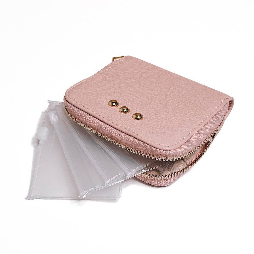 Pink wallet with gold accents on a white background