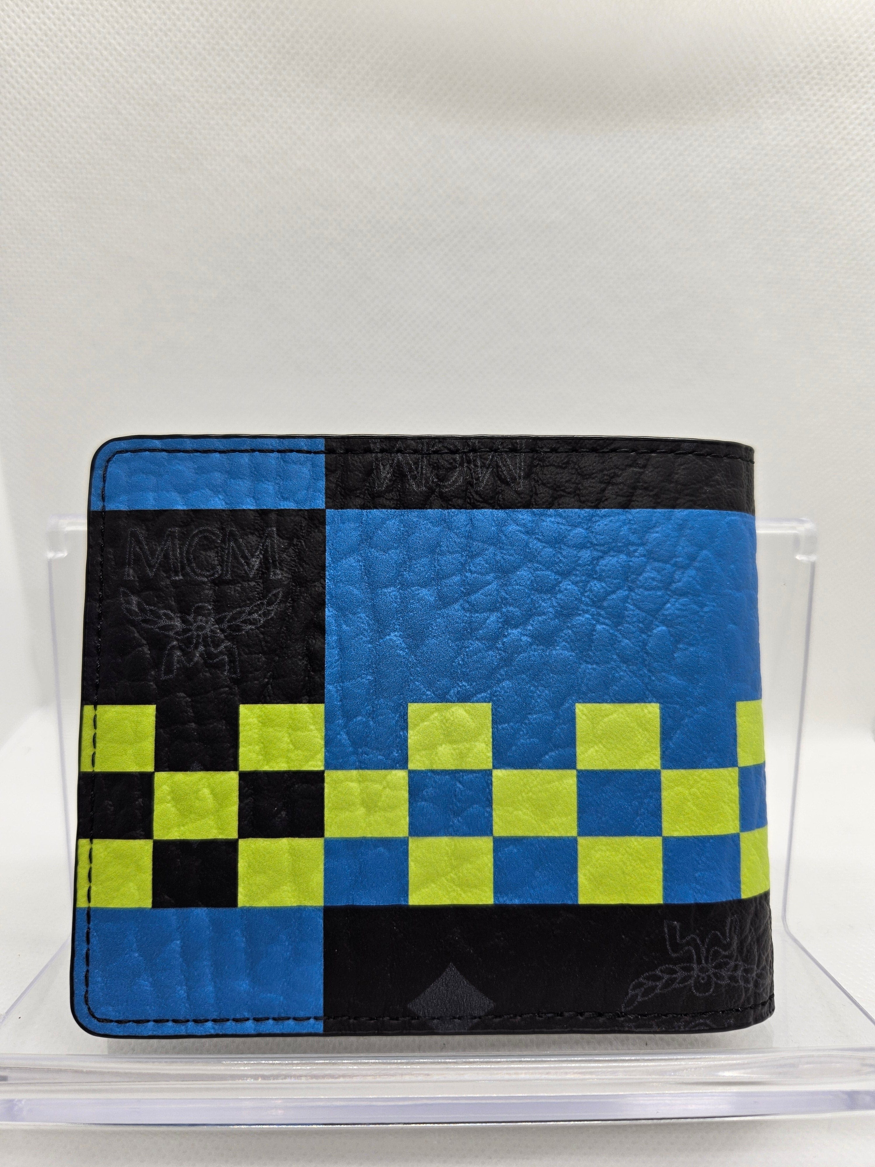 Blue, black, and green checkered wallet on a white background