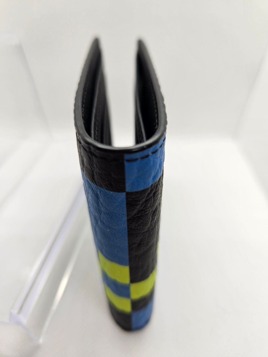 Black and blue striped object on a white background