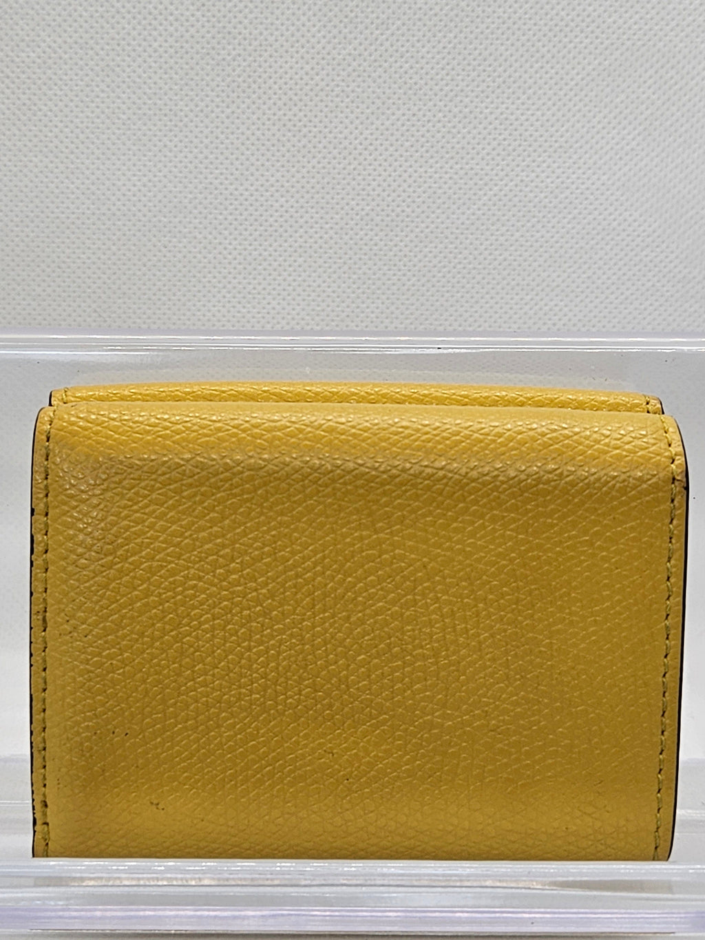 Yellow leather wallet on a white background