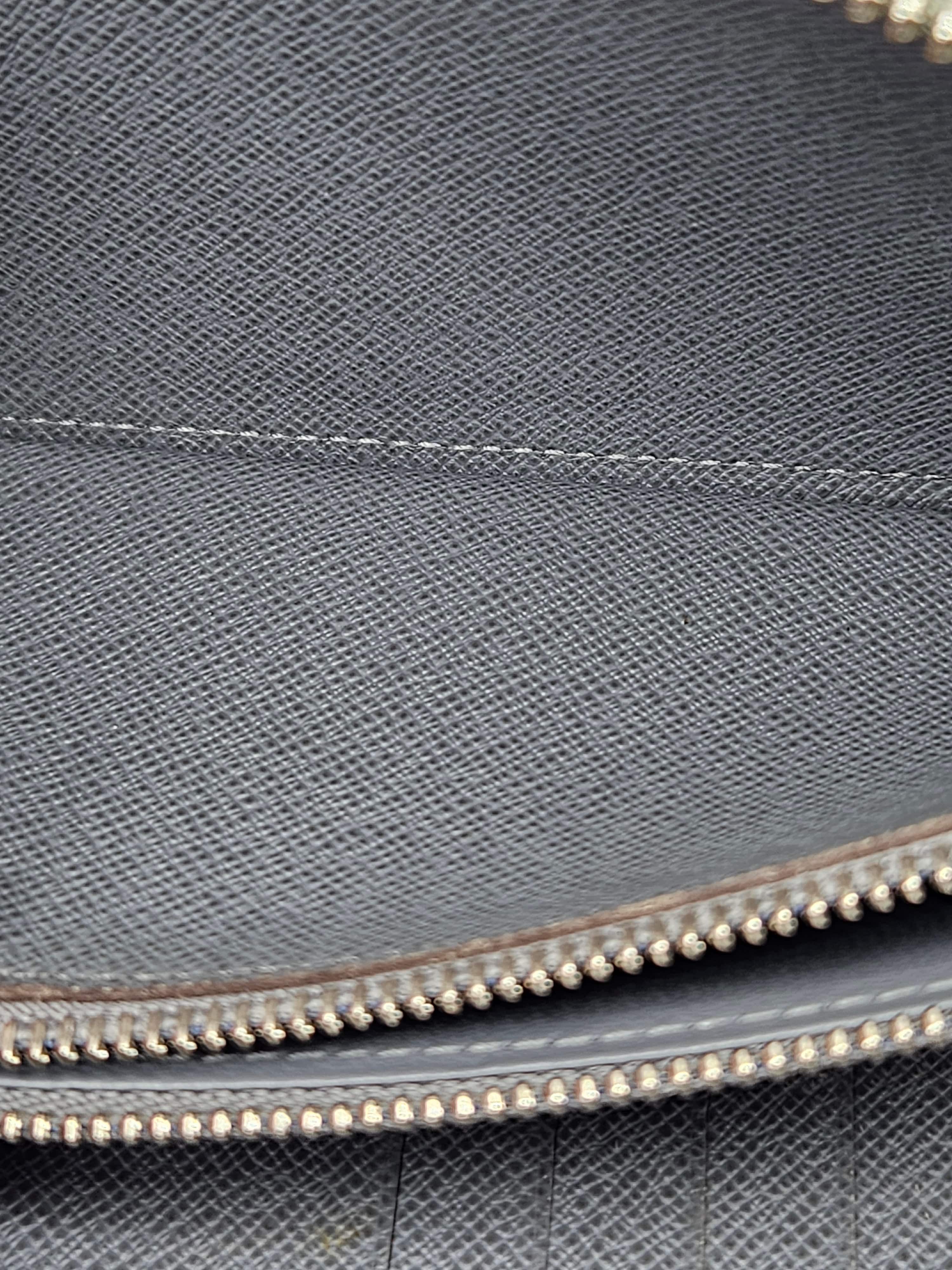 Louis Vuitton Zippy Vertical Wallet – Taiga Leather Ardoise | Pre-Owned