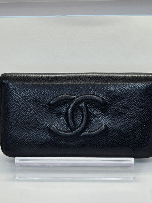 Black textured wallet with a brand logo on a white background