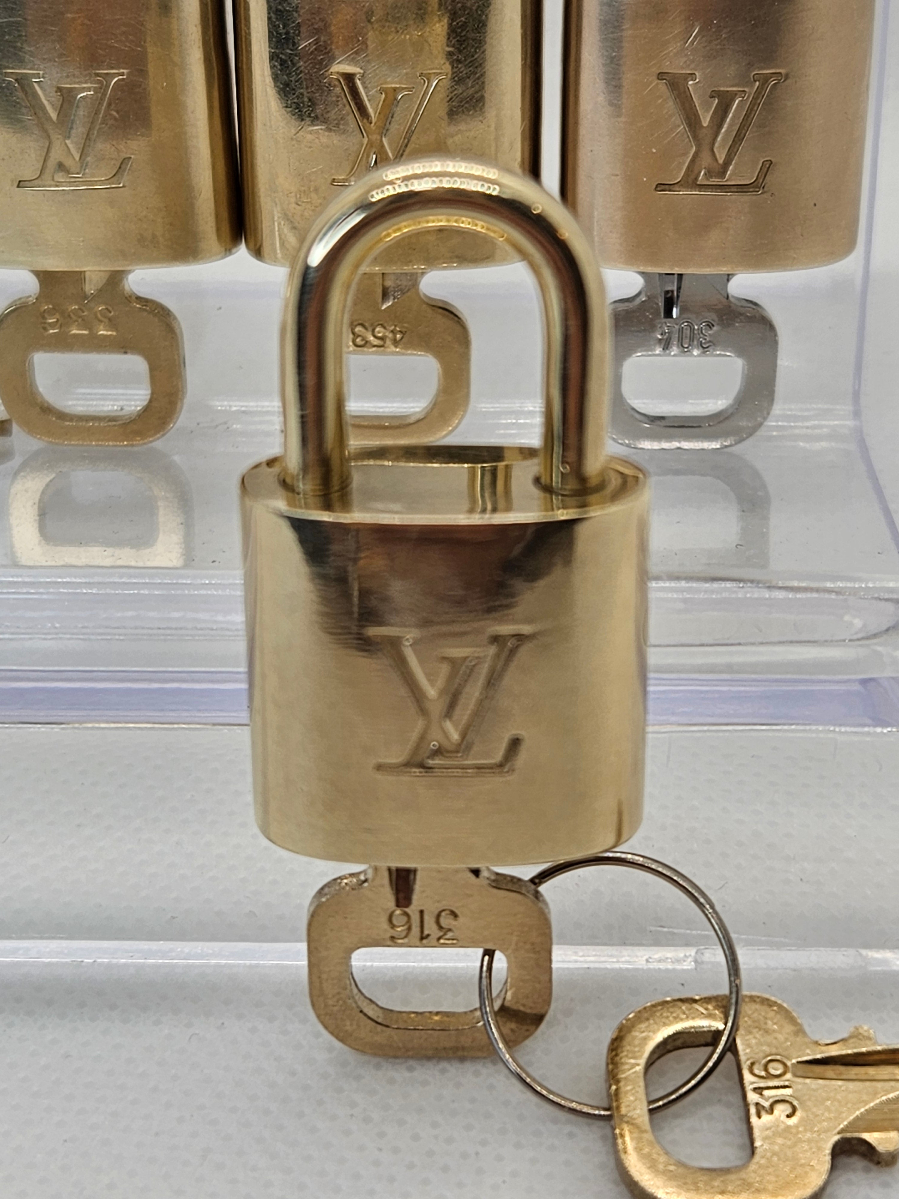 Pre-Loved Louis Vuitton Gold Lock and Key Set – Beans For Luxury