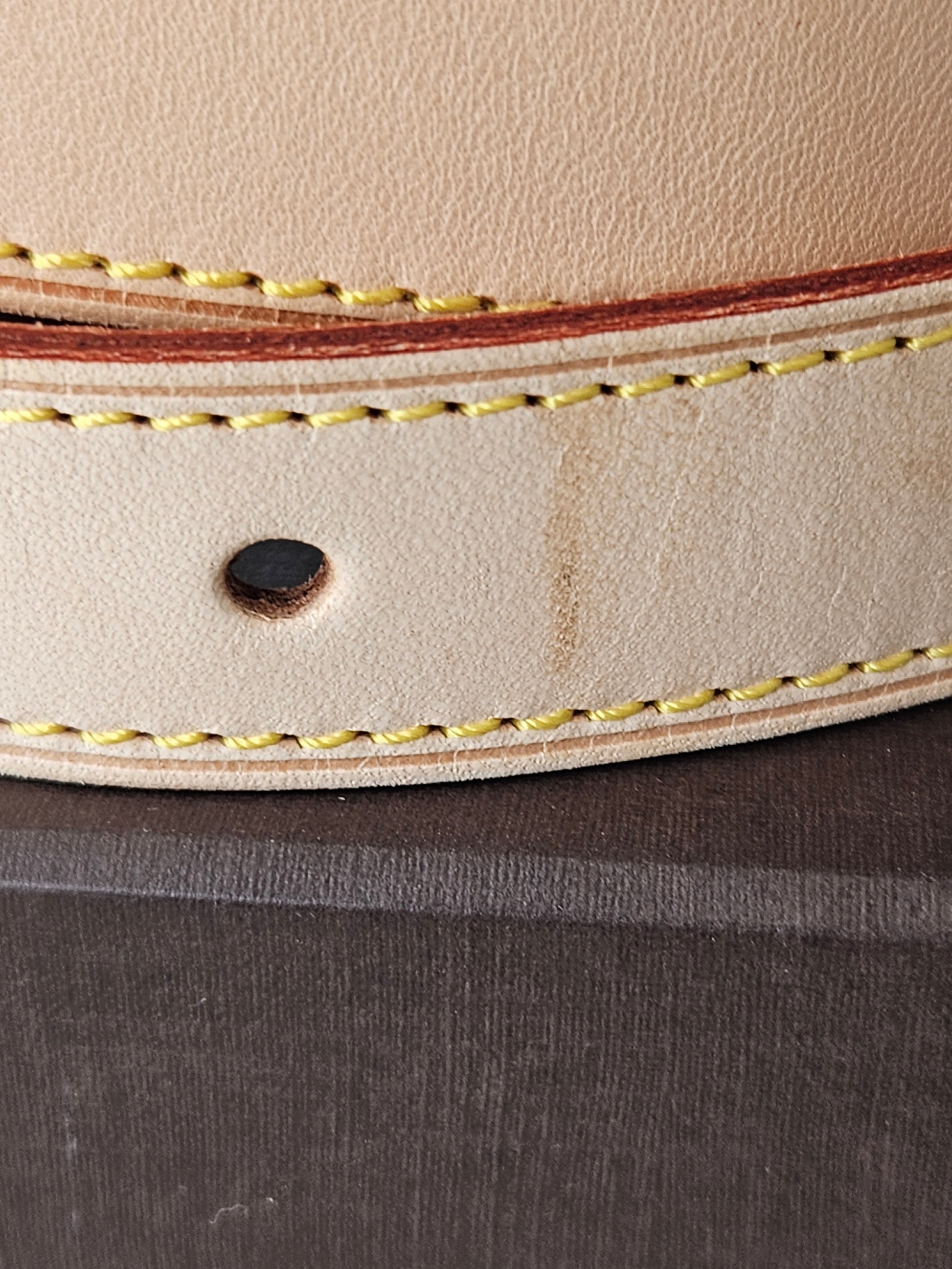 mark on exterior Louis Vuitton tan leather Vachetta Strap