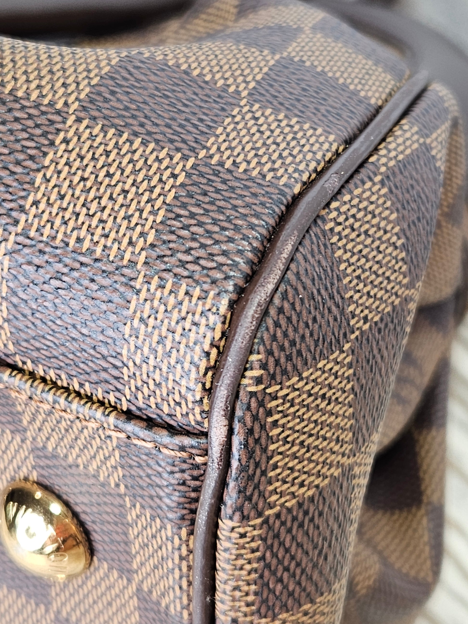 corner Louis Vuitton Trevi Damier Ebene Brown checkered canvas PM