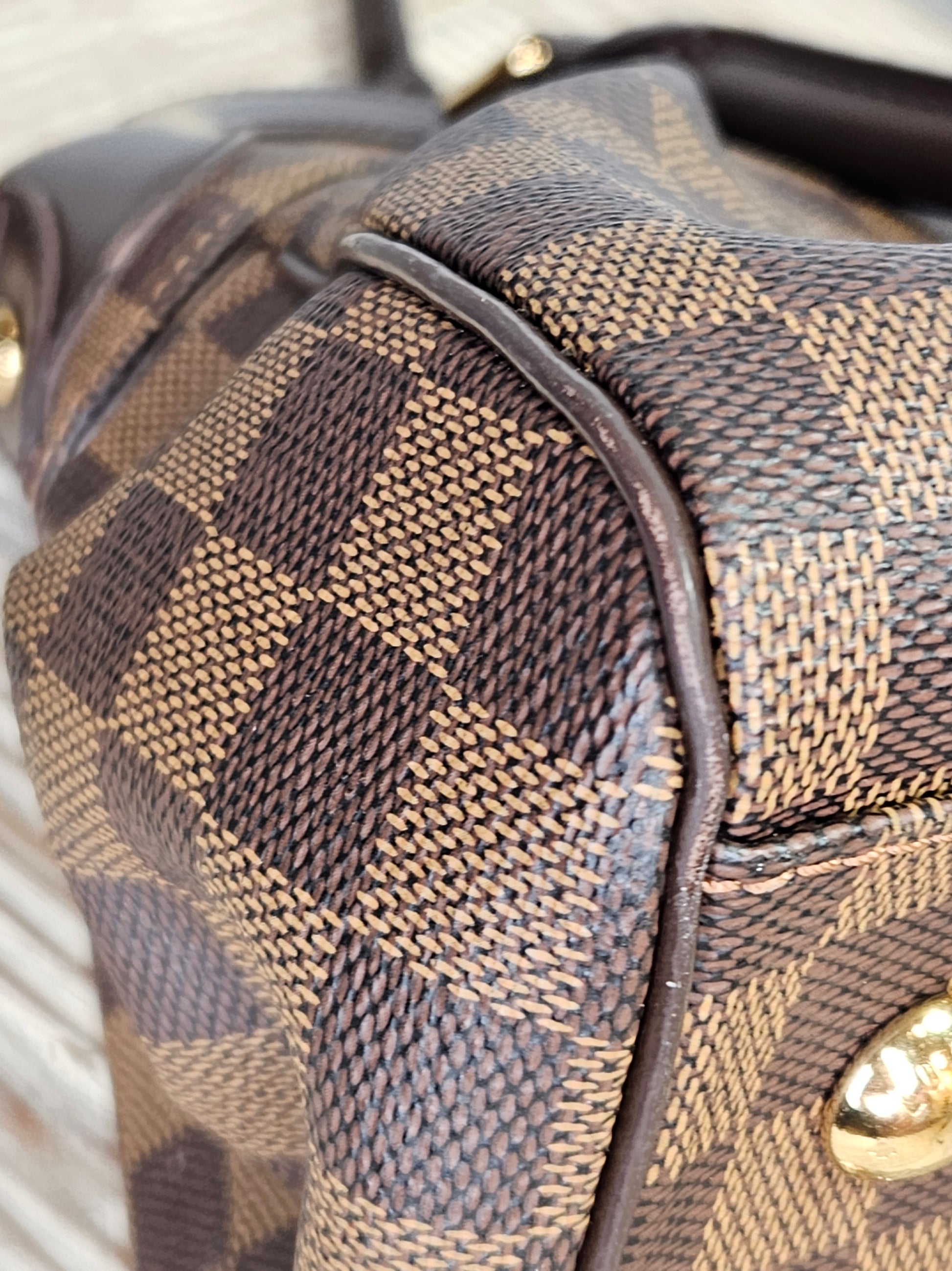 corner Louis Vuitton Trevi Damier Ebene Brown checkered canvas PM