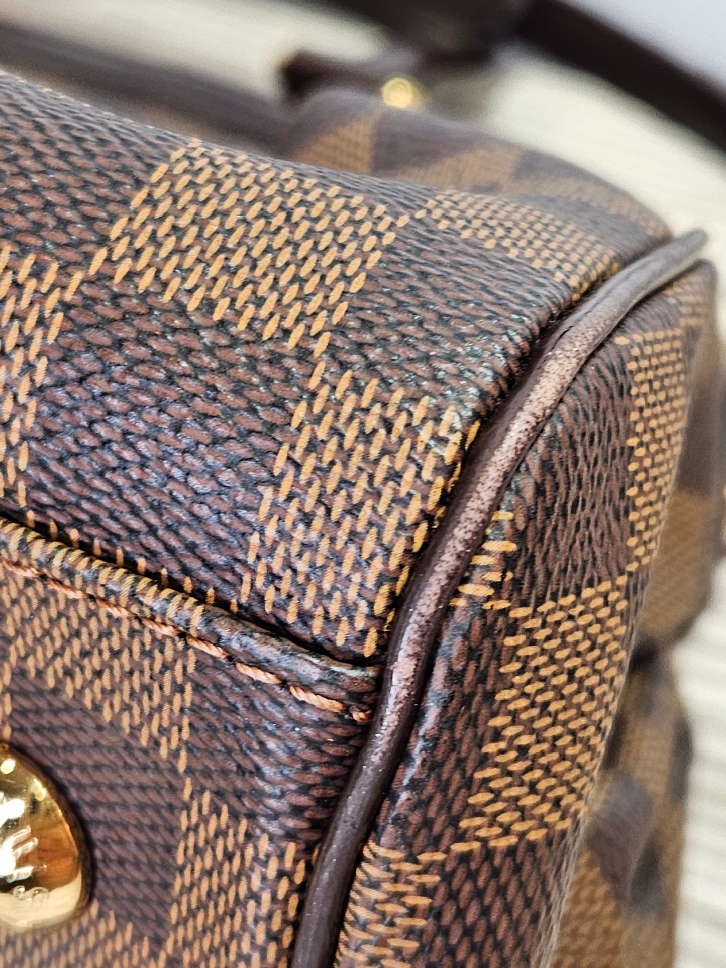 corner Louis Vuitton Trevi Damier Ebene Brown checkered canvas PM