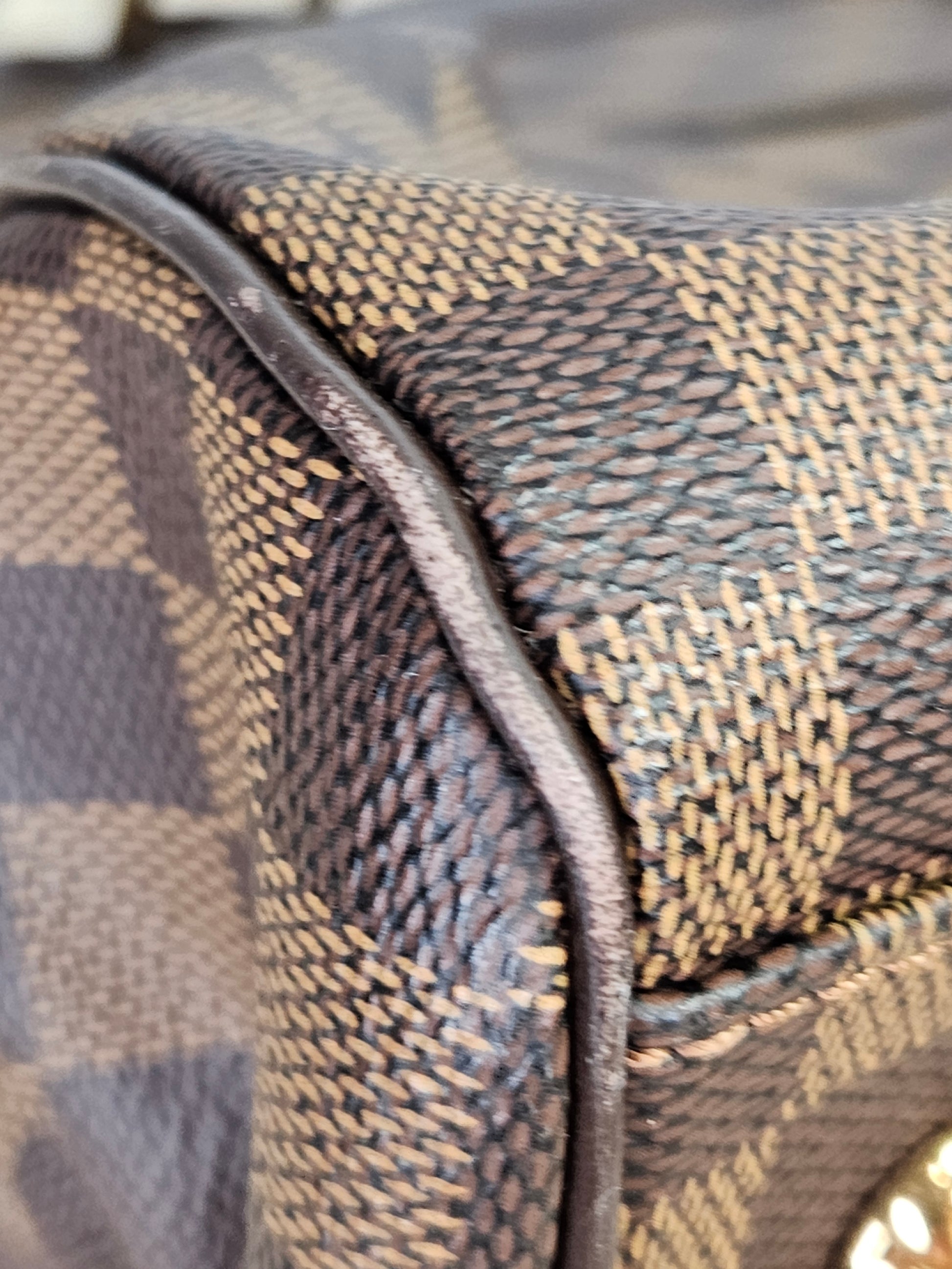 corner Louis Vuitton Trevi Damier Ebene Brown checkered canvas PM