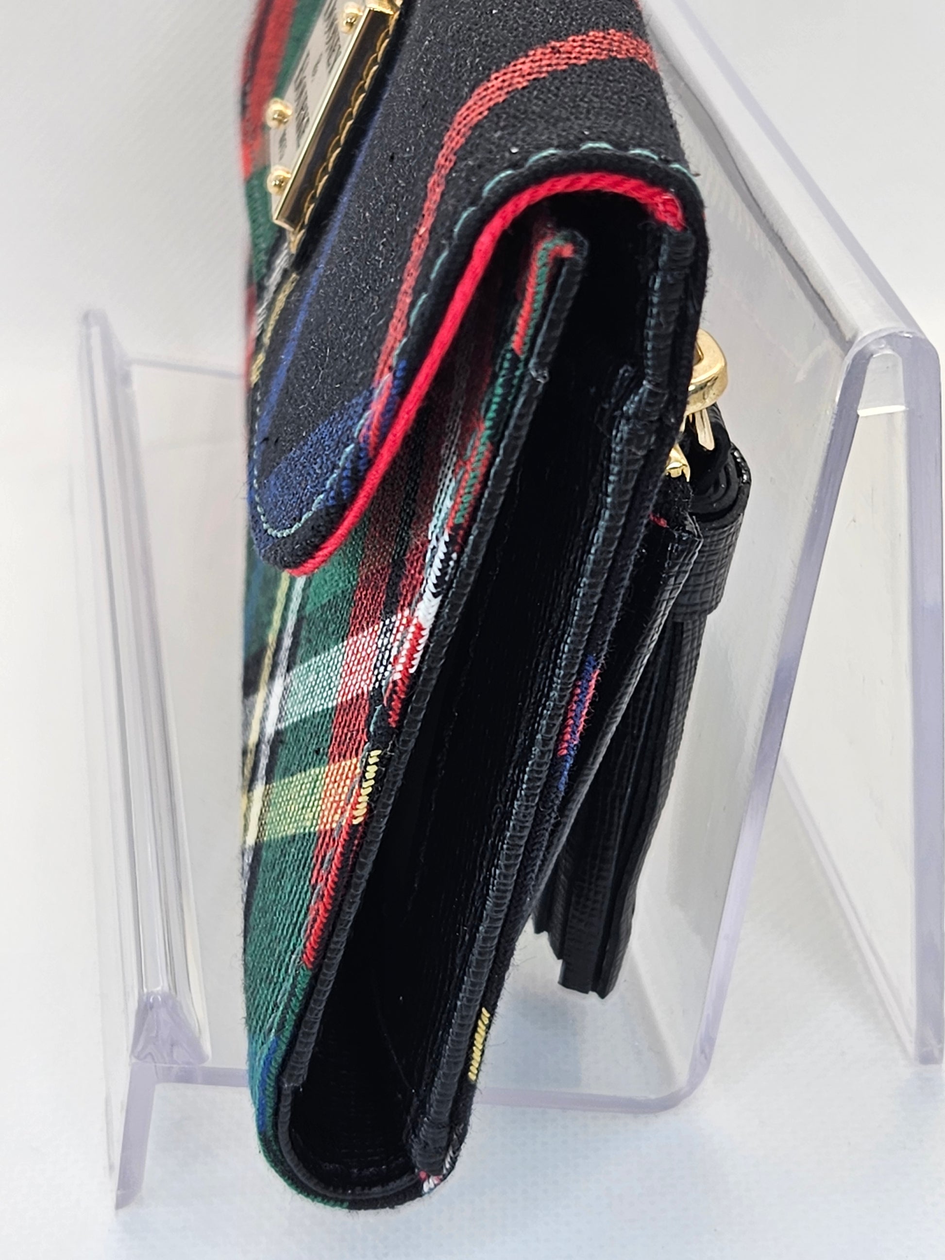 side edge Dooney & Bourke Tartan Continental Clutch black plaid red and green