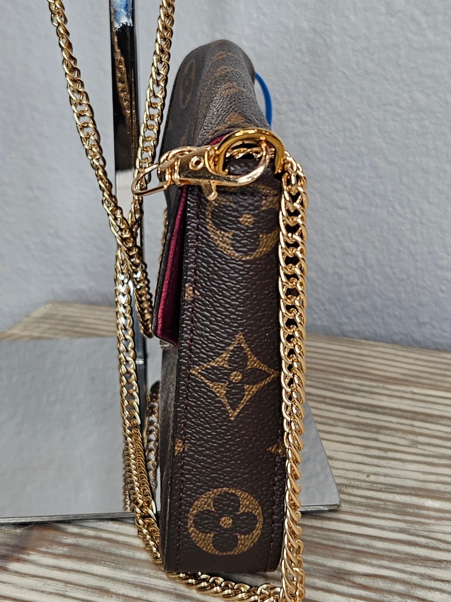 side Louis Vuitton brown canvas Monogram Pochette Felicie Chain Wallet Fuschia