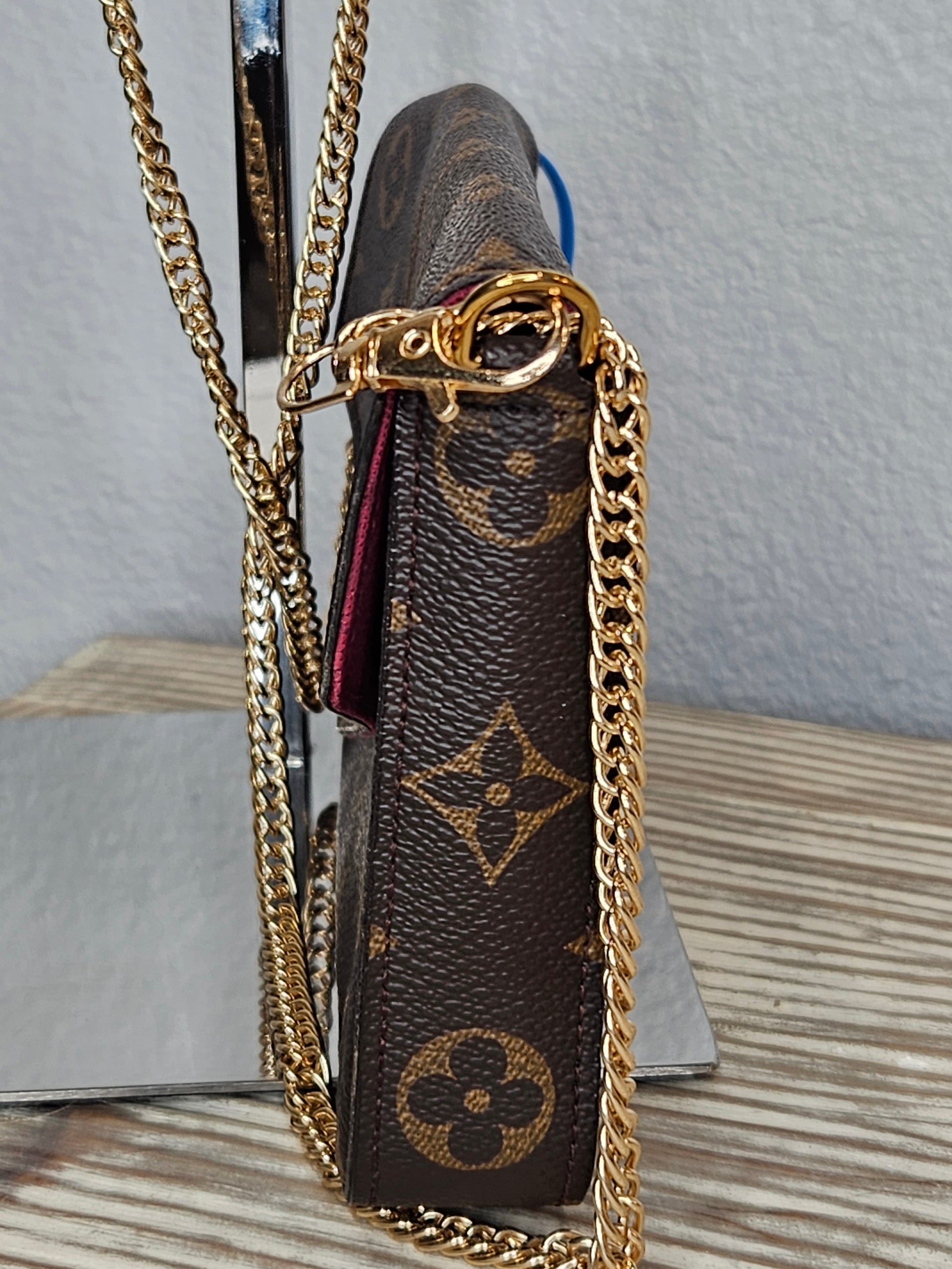 side Louis Vuitton brown canvas Monogram Pochette Felicie Chain Wallet Fuschia