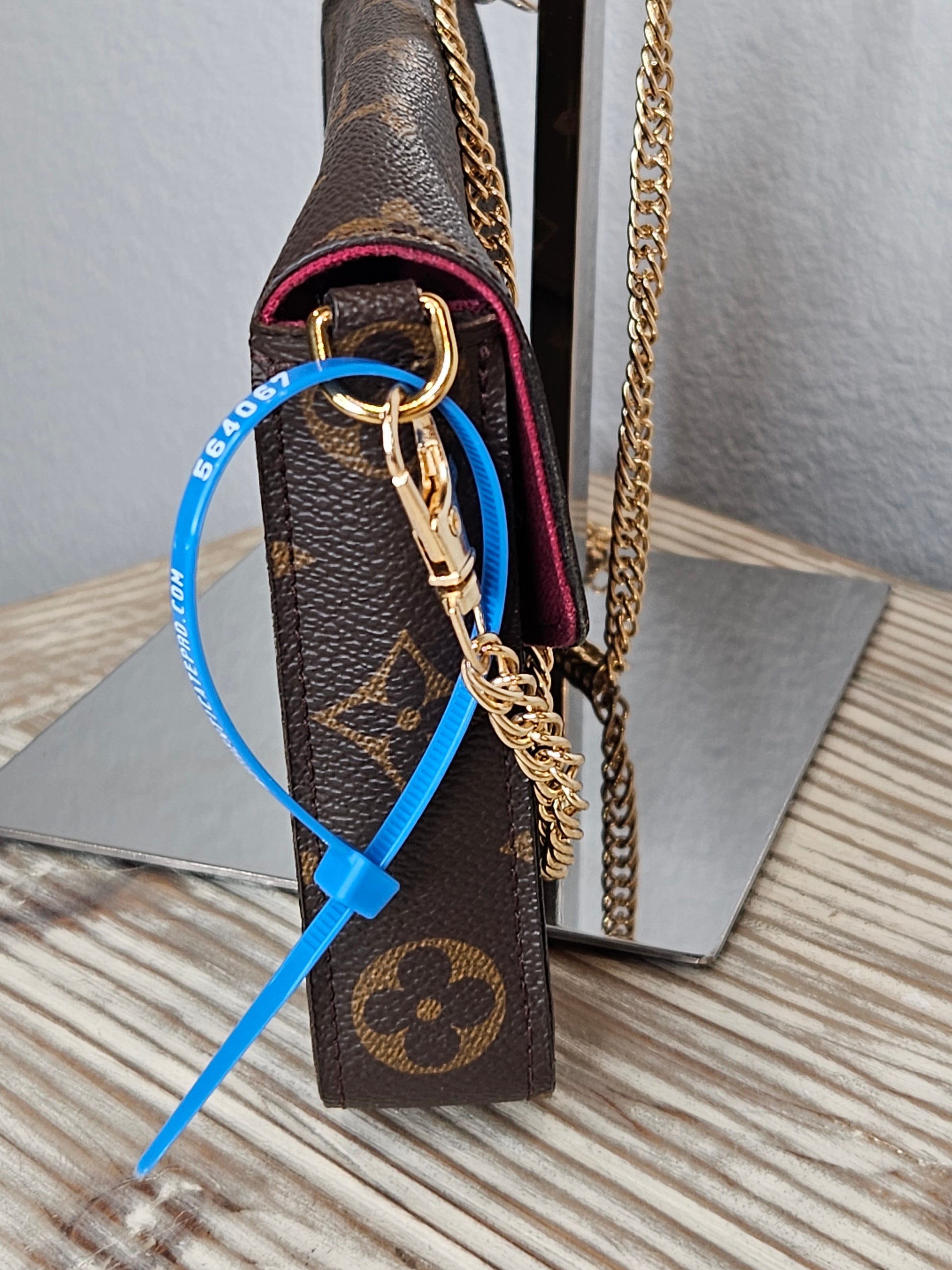 side Louis Vuitton brown canvas Monogram Pochette Felicie Chain Wallet Fuschia
