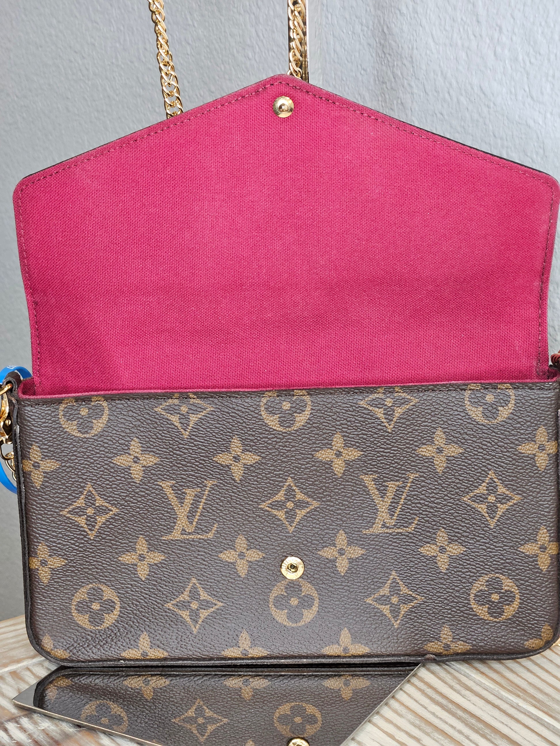 inside flap Louis Vuitton brown canvas Monogram Pochette Felicie Chain Wallet Fuschia