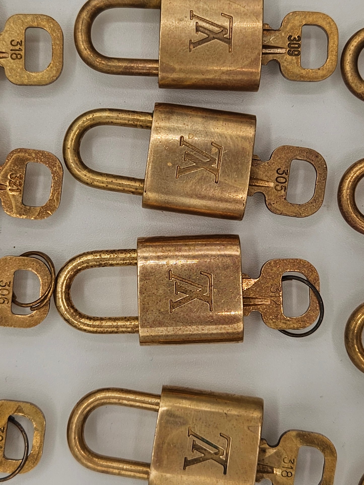 Bronze locks with a visible brand logo on a white background