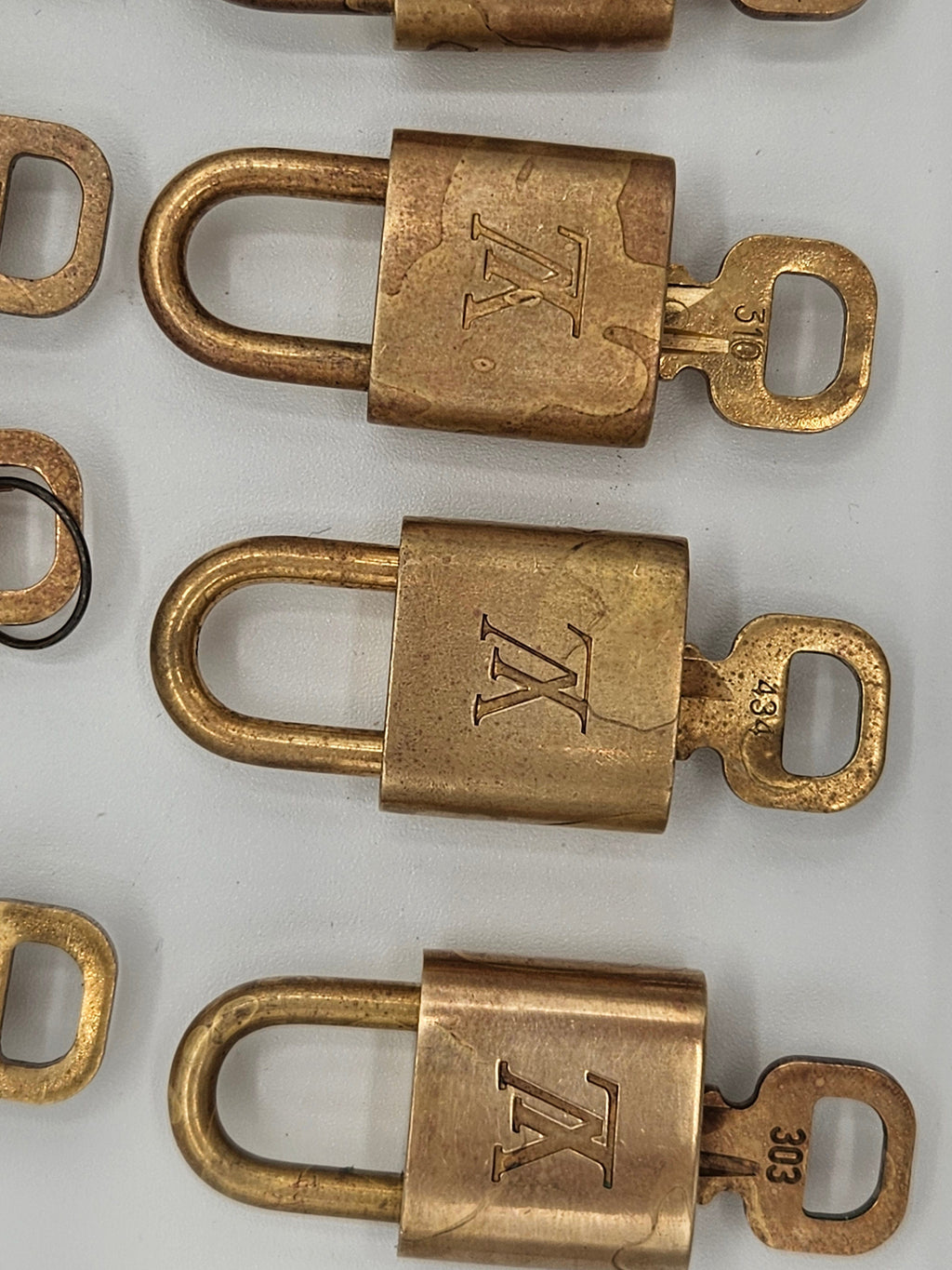 Bronze padlocks with a logo on a white background
