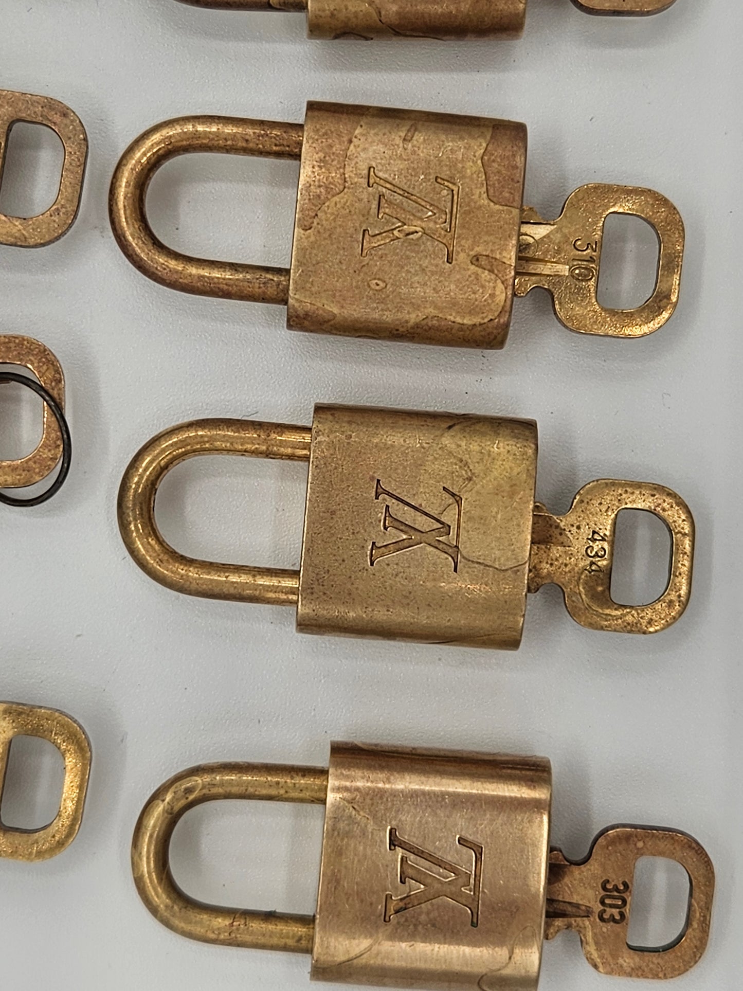 Bronze padlocks with a logo on a white background