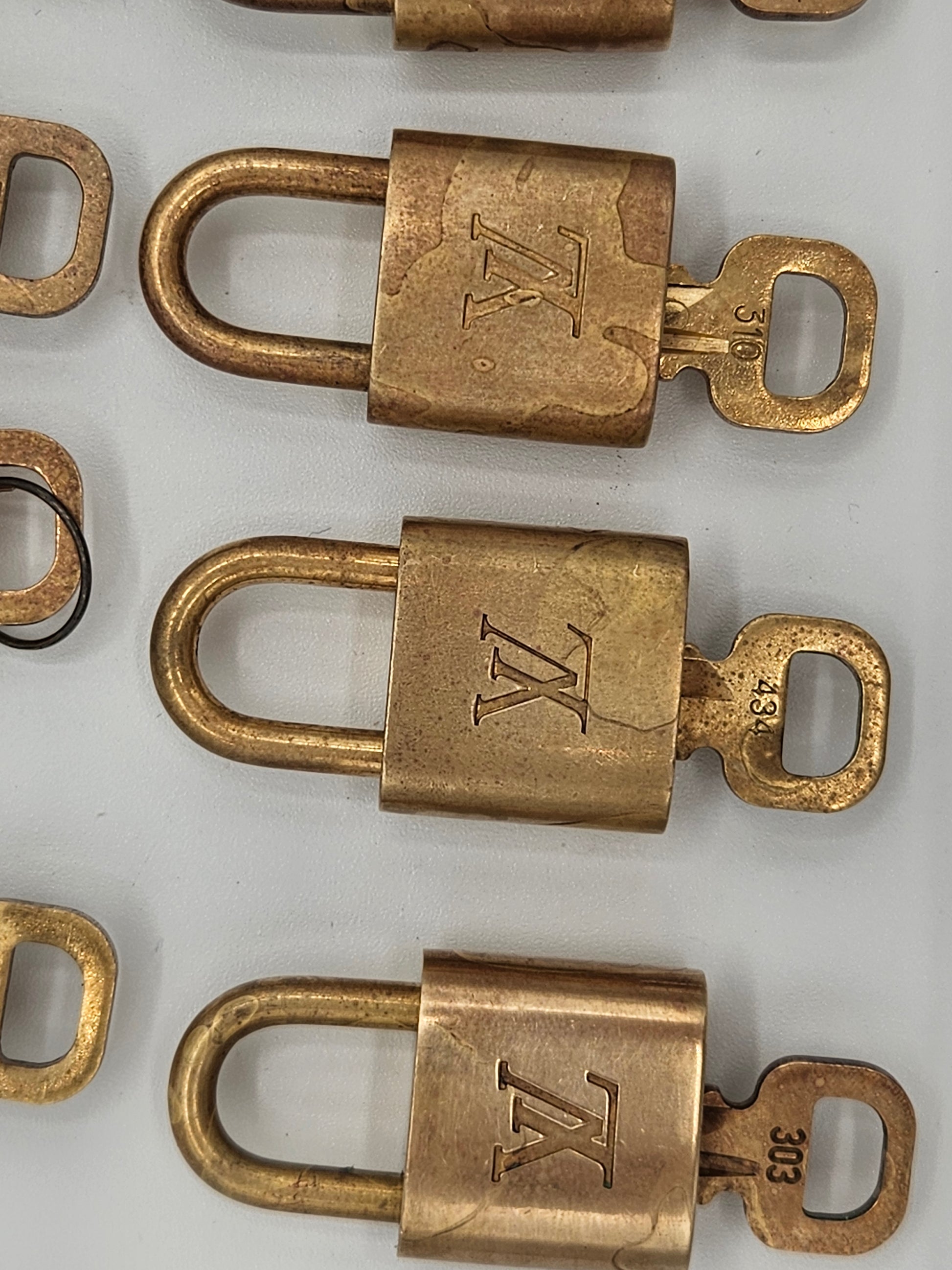 Bronze padlocks with a logo on a white background